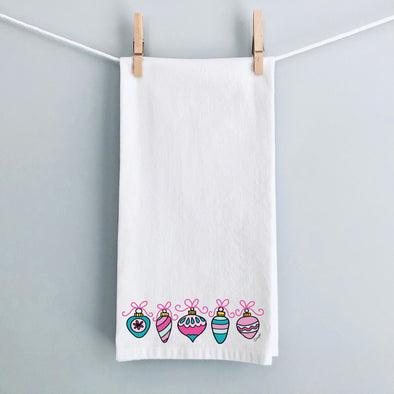 Pink Bow Christmas Ornaments flour sack tea towel by Debbie Vinyard hanging for display, holiday kitchen décor, hostess gift.